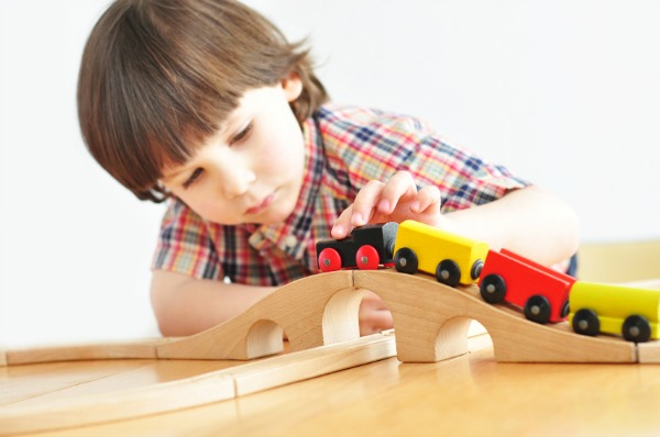 preschool-boy-playing-with-train